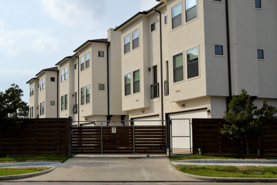 real-estate, for rent, rented, driveway, gated community, duplex, residential, architecture, outdoors, house, facade, building, window, street, pavement, daylight, sky, exterior, apartment, town, home, estate, real, modern, property, design, housing, structure, residence, set, collection, townhouse, rental, brown, fence, gate, grass, mowed, lawn, occupied, occupy, investment, people, real life, brokerage, dwelling, affordable, low income housing, middle class, lower class, first apartment, hotel, townhouse check point, houston, texas, check-point, rent, business, on post, security, guard, guard house, security post, post, alert, nature, ready, safety, gates, lock-down, locked, closed, firm, real estate, street side, entrance, enter, development, apartment complex, houston texas, town house, red, black gate, gated, secured, security gate