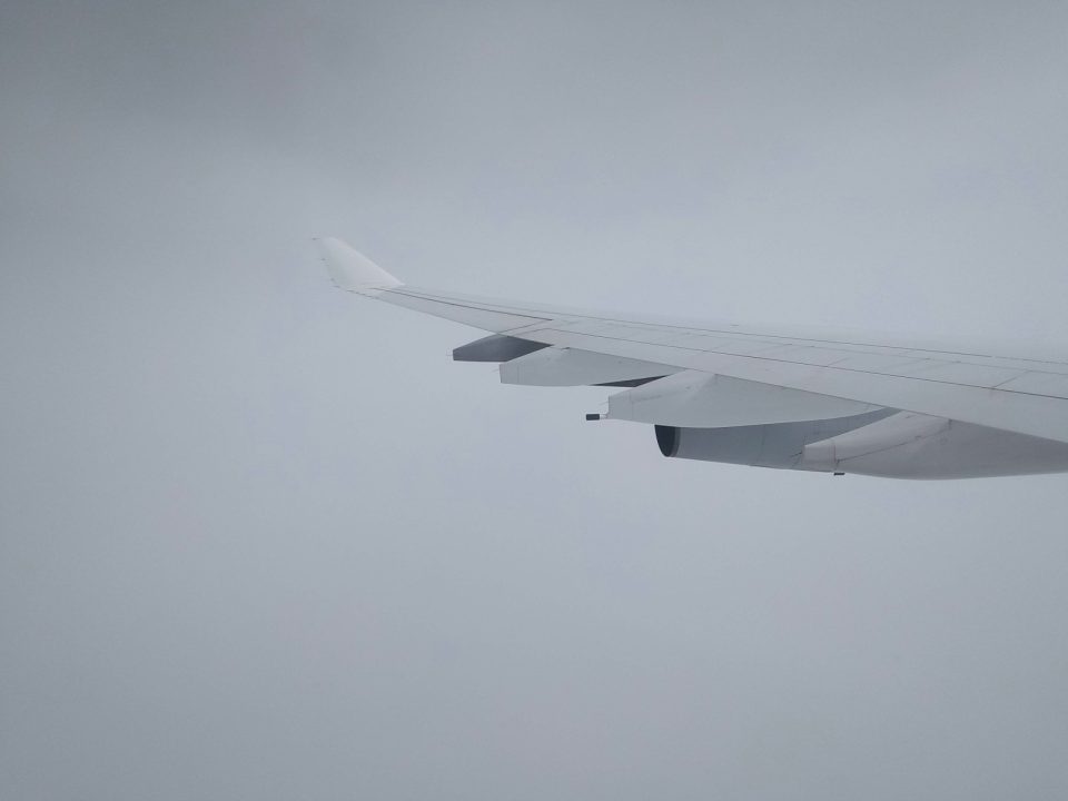 white airplane wing during daytime