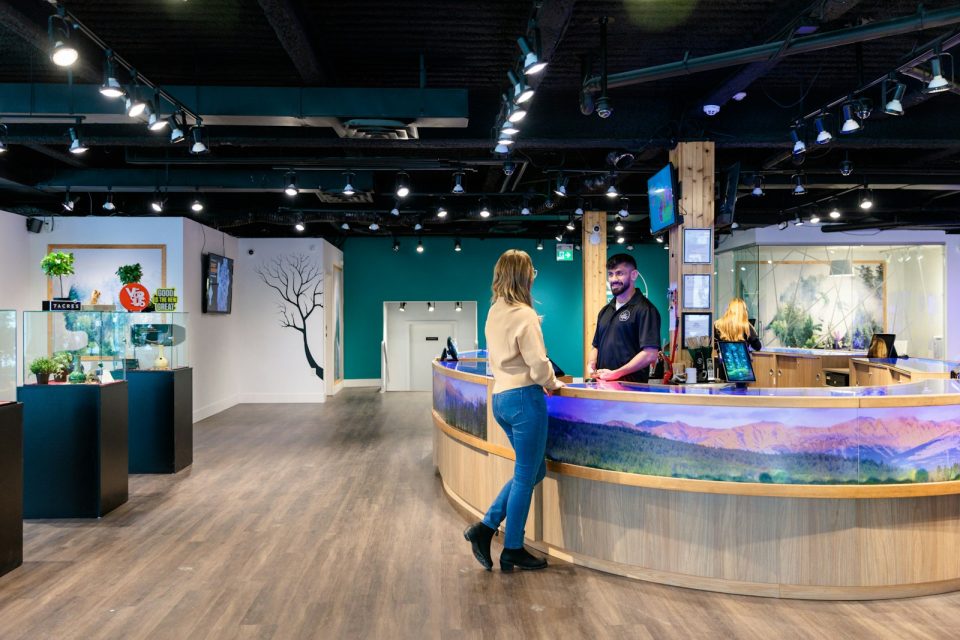 a couple of people that are standing in front of a counter