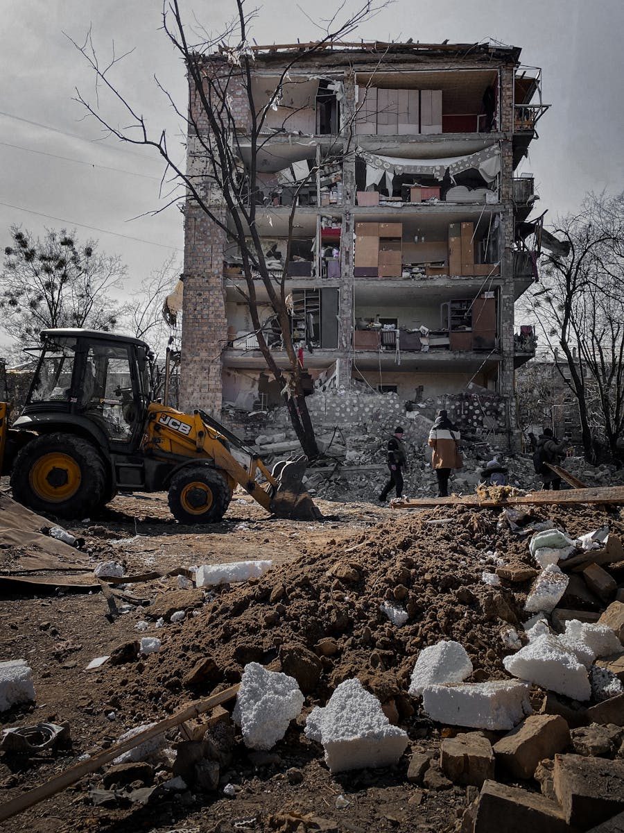 A destroyed building in Kyiv, Ukraine, showing urban devastation and reconstruction efforts.