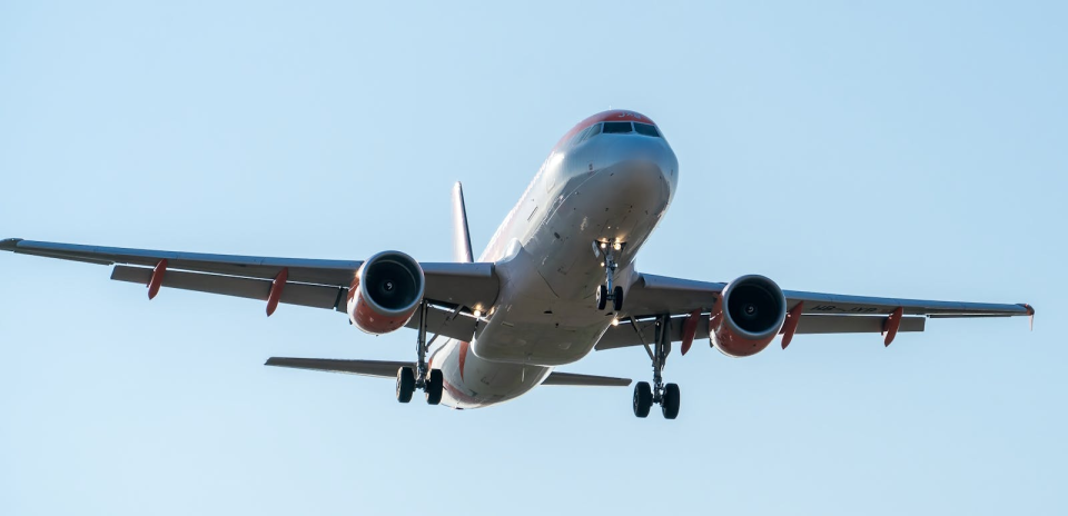 Airplane approaching for landing on a clear day in Manises, Community of Valencia, Spain.