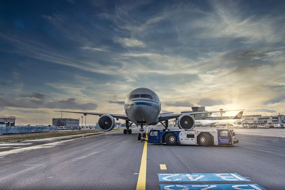 airplane, nature, runway, airport, tarmac, aircraft, vehicle, truck, airliner, clouds, asphalt, jet, flight, transportation system, air travel, outdoor, airline, plane, transportation, travel, airfield