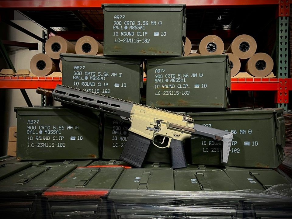 Rifle resting on stacked ammunition crates