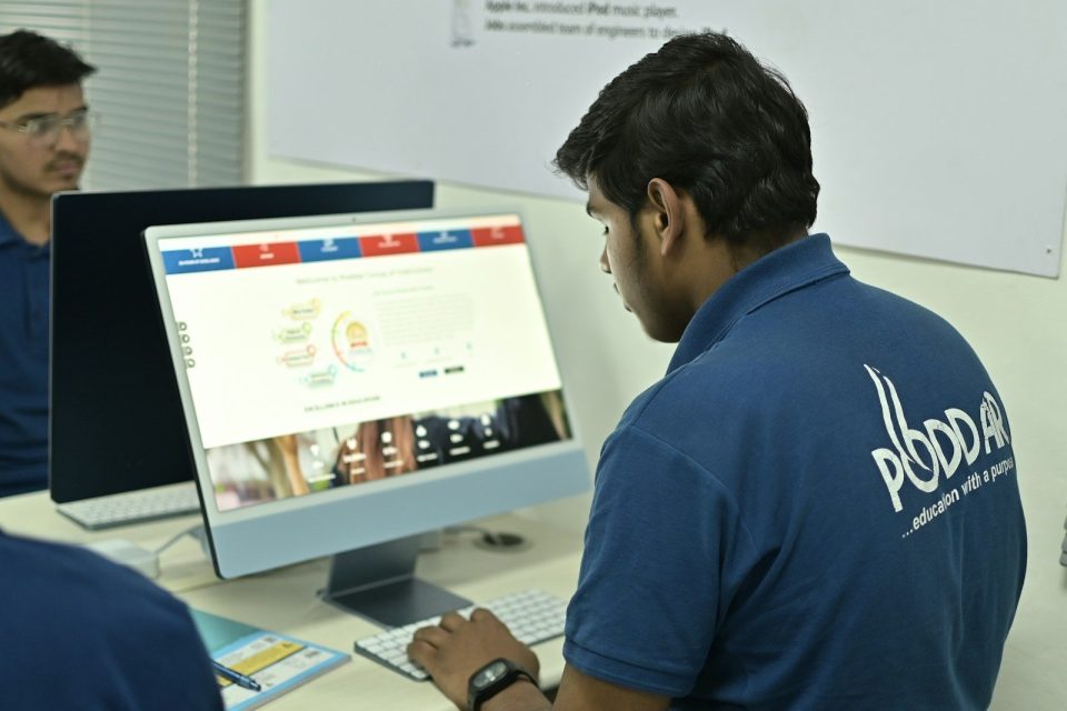 A young man working on a computer