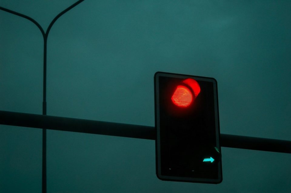The traffic light shows a red light